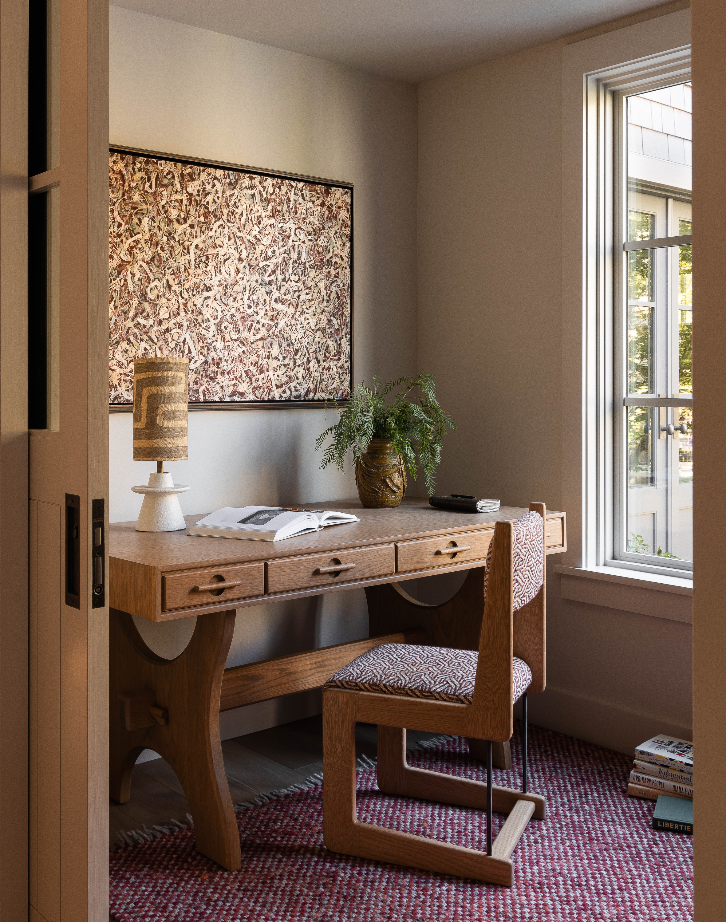 The client desired a more playful office space. Artisan furniture and hand-woven carpet were incorporated to add color and shape, creating a vibrant workspace.