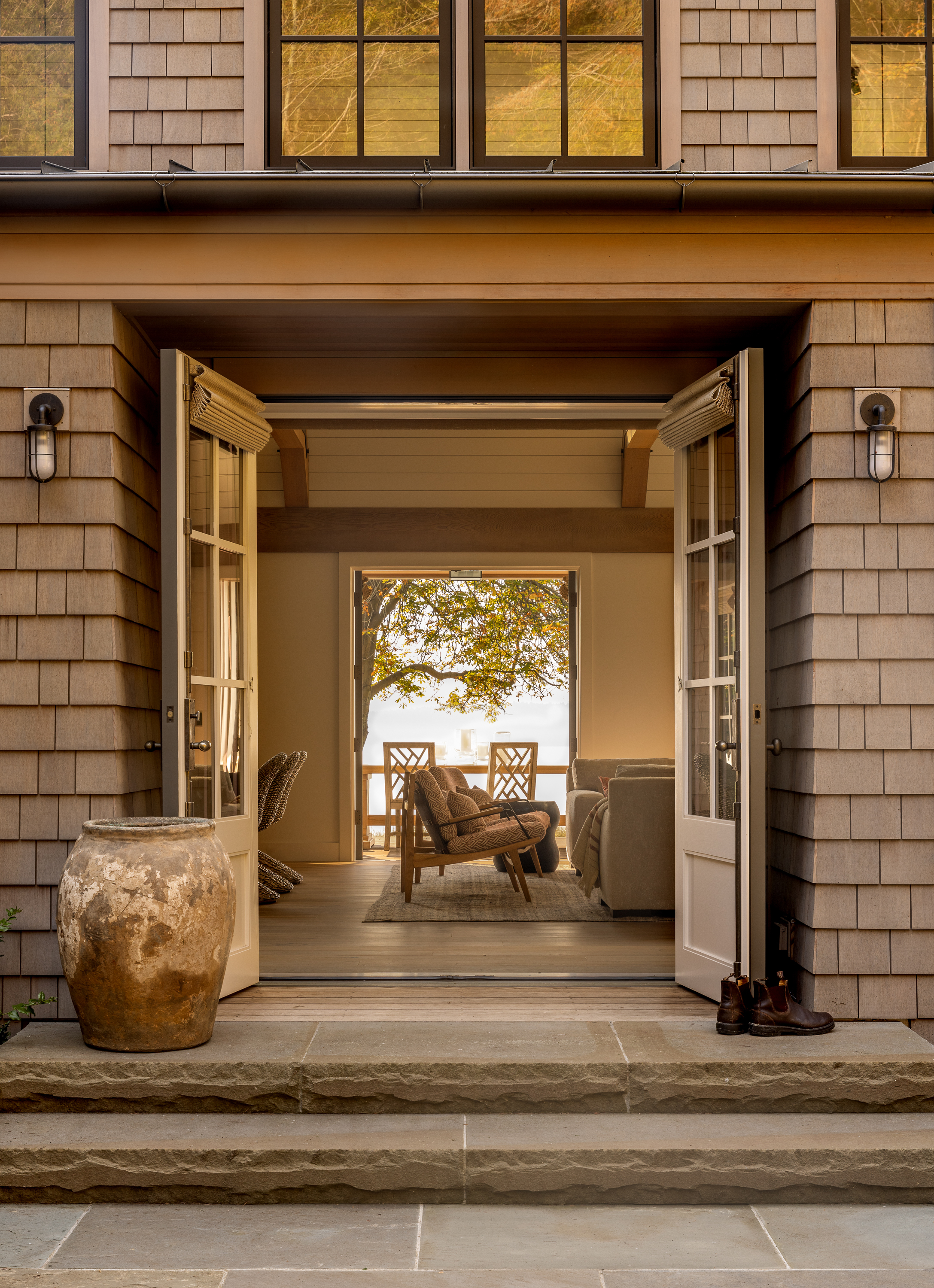 the main entry, showcasing a design that offers a clear view through the entire house to the other side upon entering